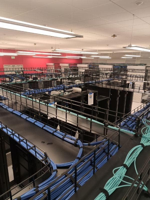 overhead view of datacenter racks cabling